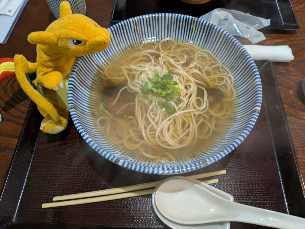 A delicious bowl of traditional Kyoto Nishin Soba featuring sweet-savory simmered herring