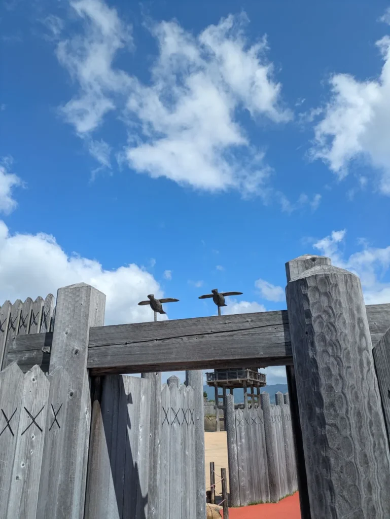 Bird ornaments perched on a gate at the Yoshinogari Site